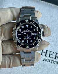 Rolex submariner silver with black rotating dial with date